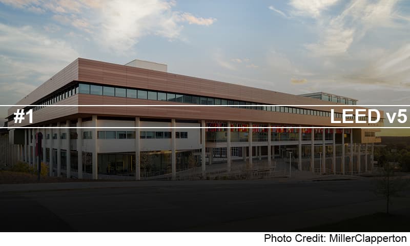 an image of a building with a sky background and a street sign